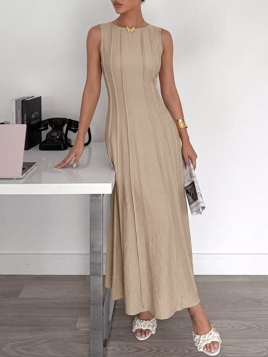 Elegant KOIBONI sleeveless maxi dress with a round neck and textured fabric, perfect for minimalist summer style.