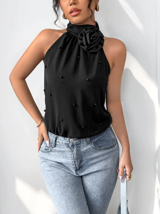 Elegant 3D flower Grecian neck bodysuit by KOIBONI featuring floral details and a sleek, fitted top design.